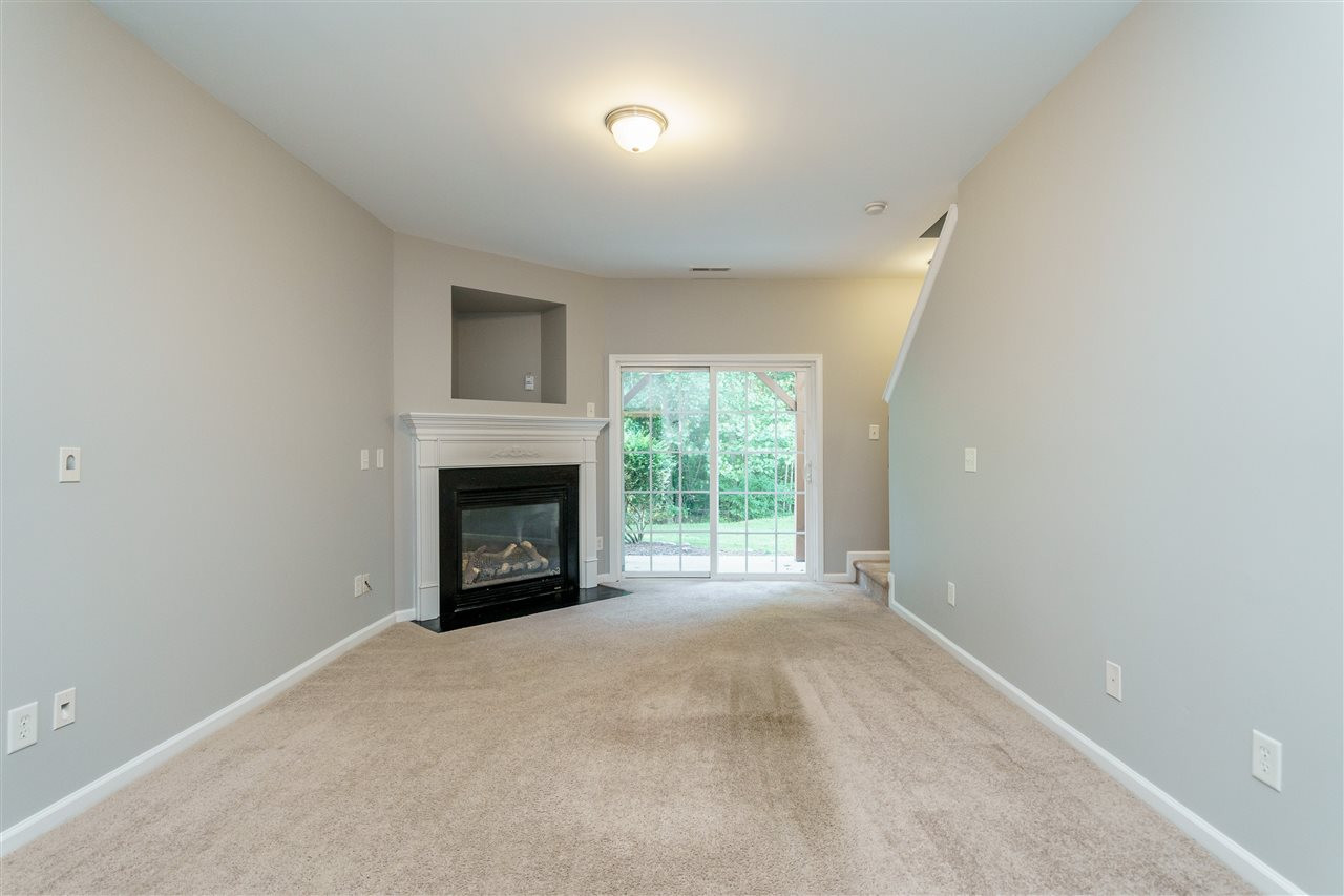 7675 Winners Edge Street Raleigh, NC 27617 - Photo 18 of 23 a view of an empty room with a window and fireplace