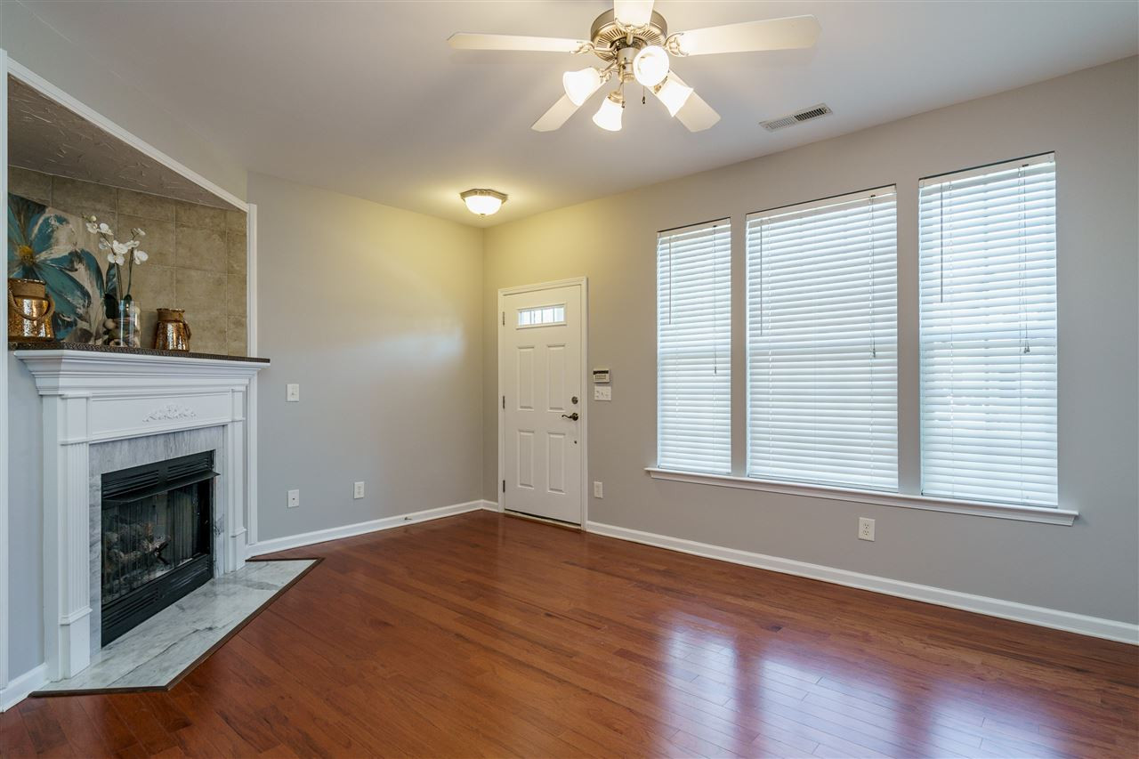 7675 Winners Edge Street Raleigh, NC 27617 - Photo 4 of 23 a view of an empty room with wooden floor and a window