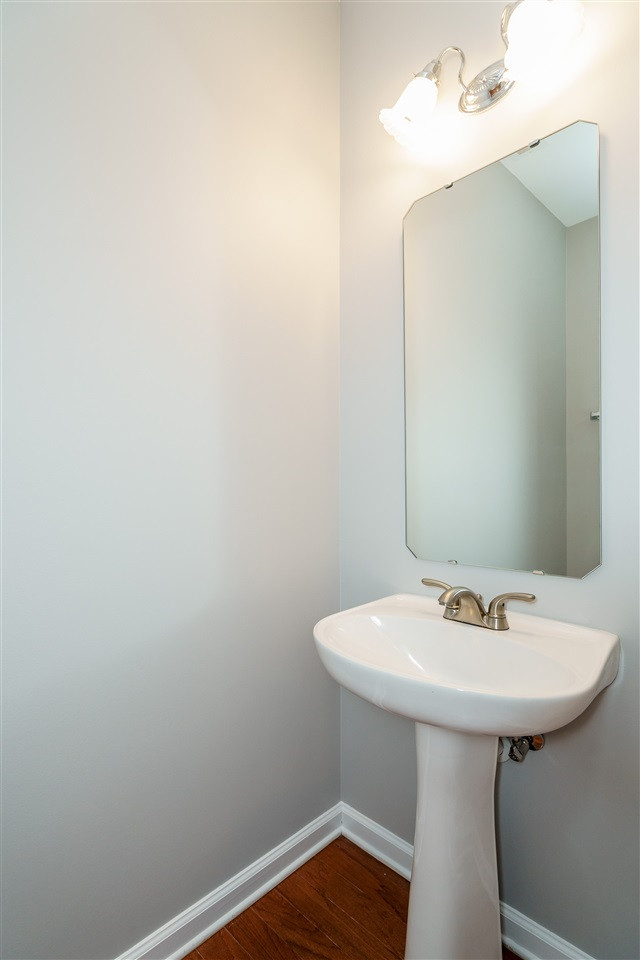 7675 Winners Edge Street Raleigh, NC 27617 - Photo 10 of 23 a bathroom with a sink and a mirror