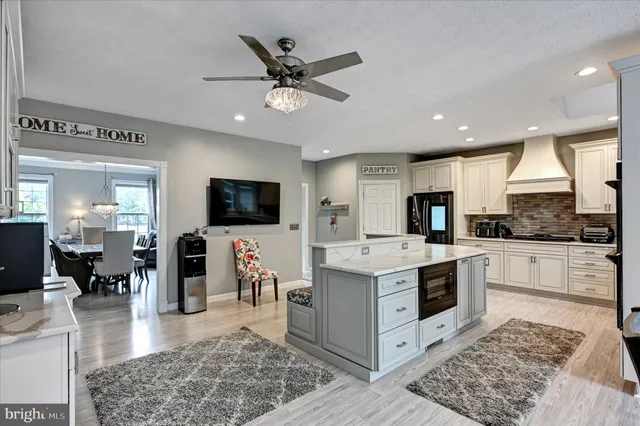 a living room with furniture fireplace and a flat screen tv