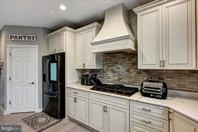 a bedroom with a large bed and a flat screen tv