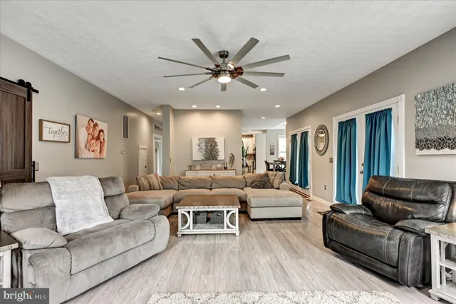 a bath tub sitting in a bathroom next to a window