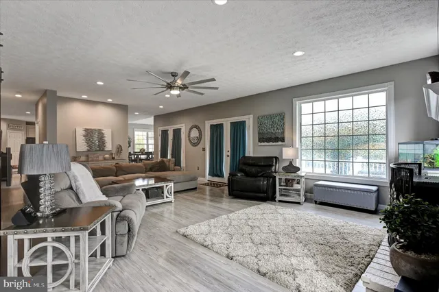 a view of a house with a yard from a balcony