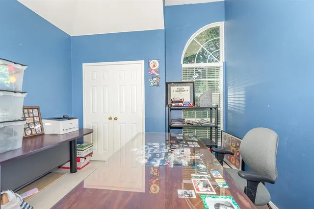 a bedroom with a bed couch and window