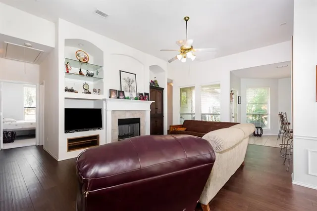 a living room with furniture fireplace and window
