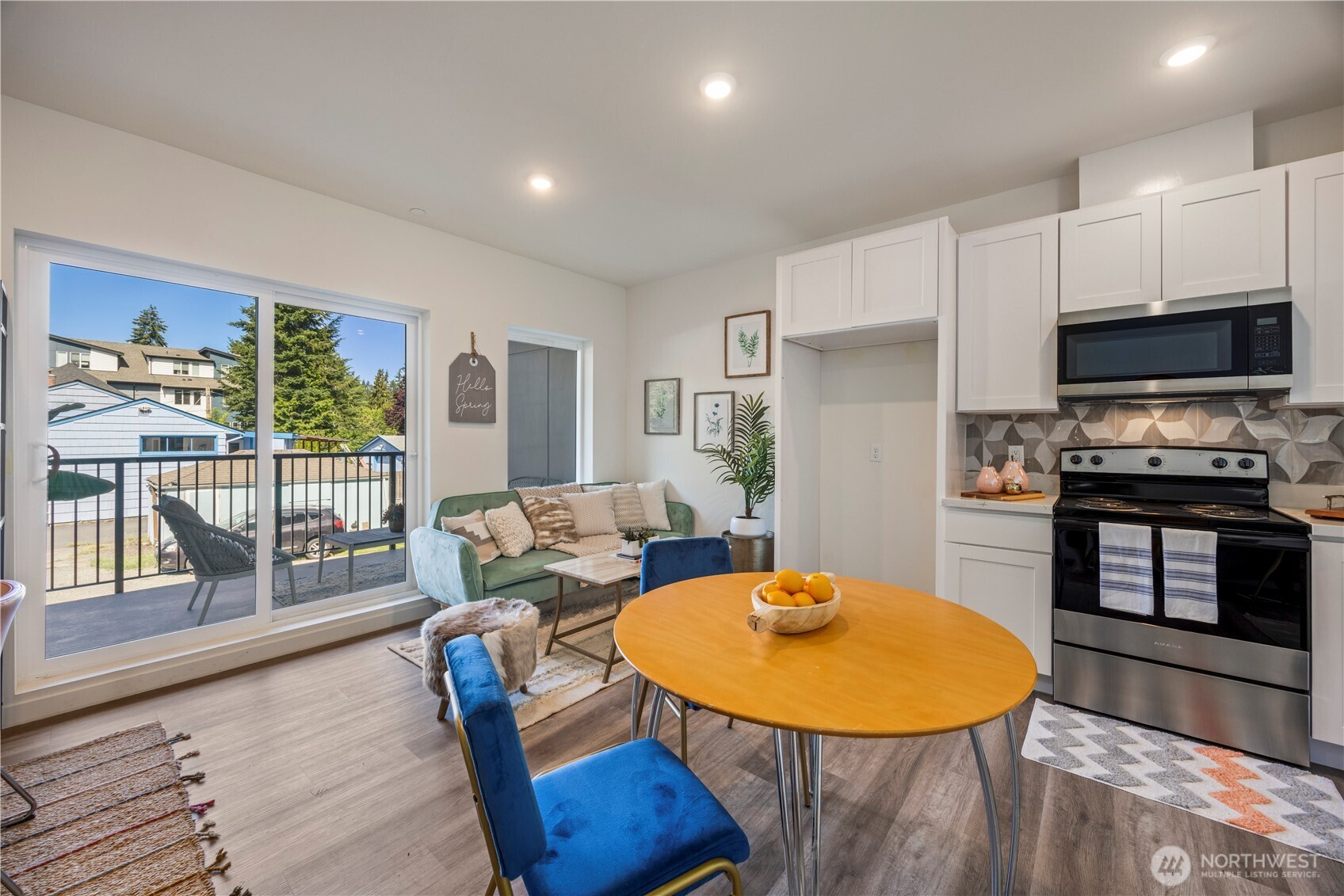 2152 North 185th Street Shoreline, WA 98133 - Photo 11 of 40 a living room with furniture and a kitchen view