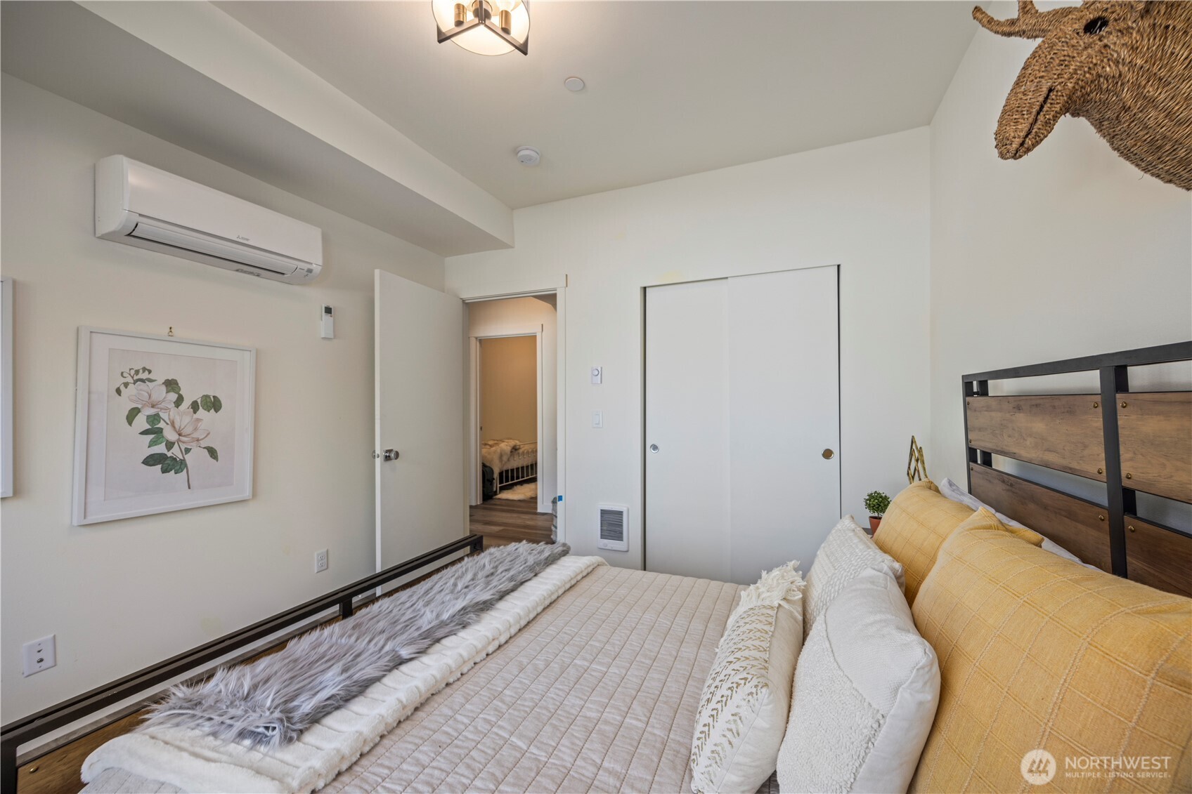 2152 North 185th Street Shoreline, WA 98133 - Photo 14 of 40 a bedroom with a bed and a painting on the wall