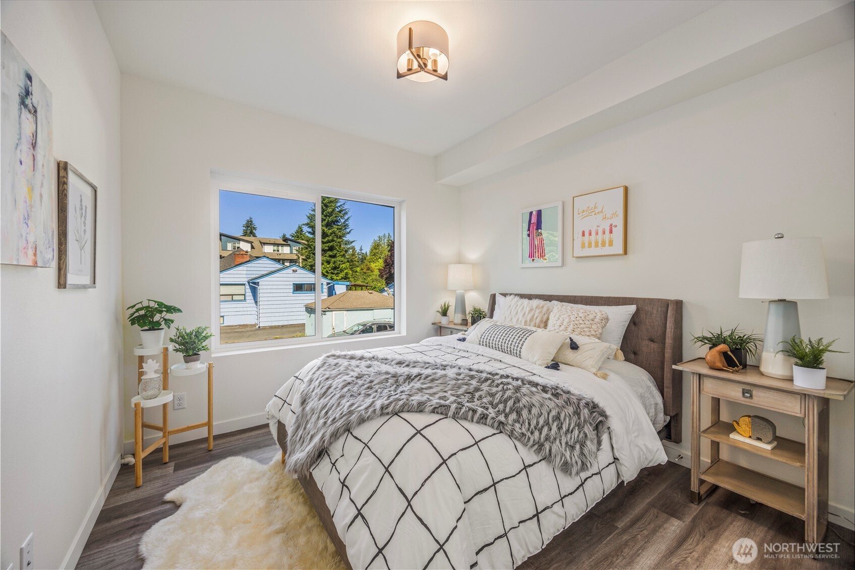 2152 North 185th Street Shoreline, WA 98133 - Photo 16 of 40 a bedroom with a bed and a chandelier