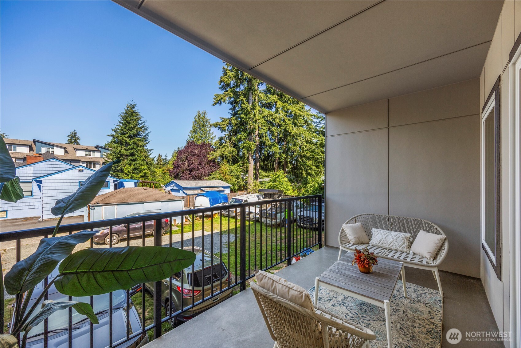 2152 North 185th Street Shoreline, WA 98133 - Photo 20 of 40 a balcony with furniture and a potted plant