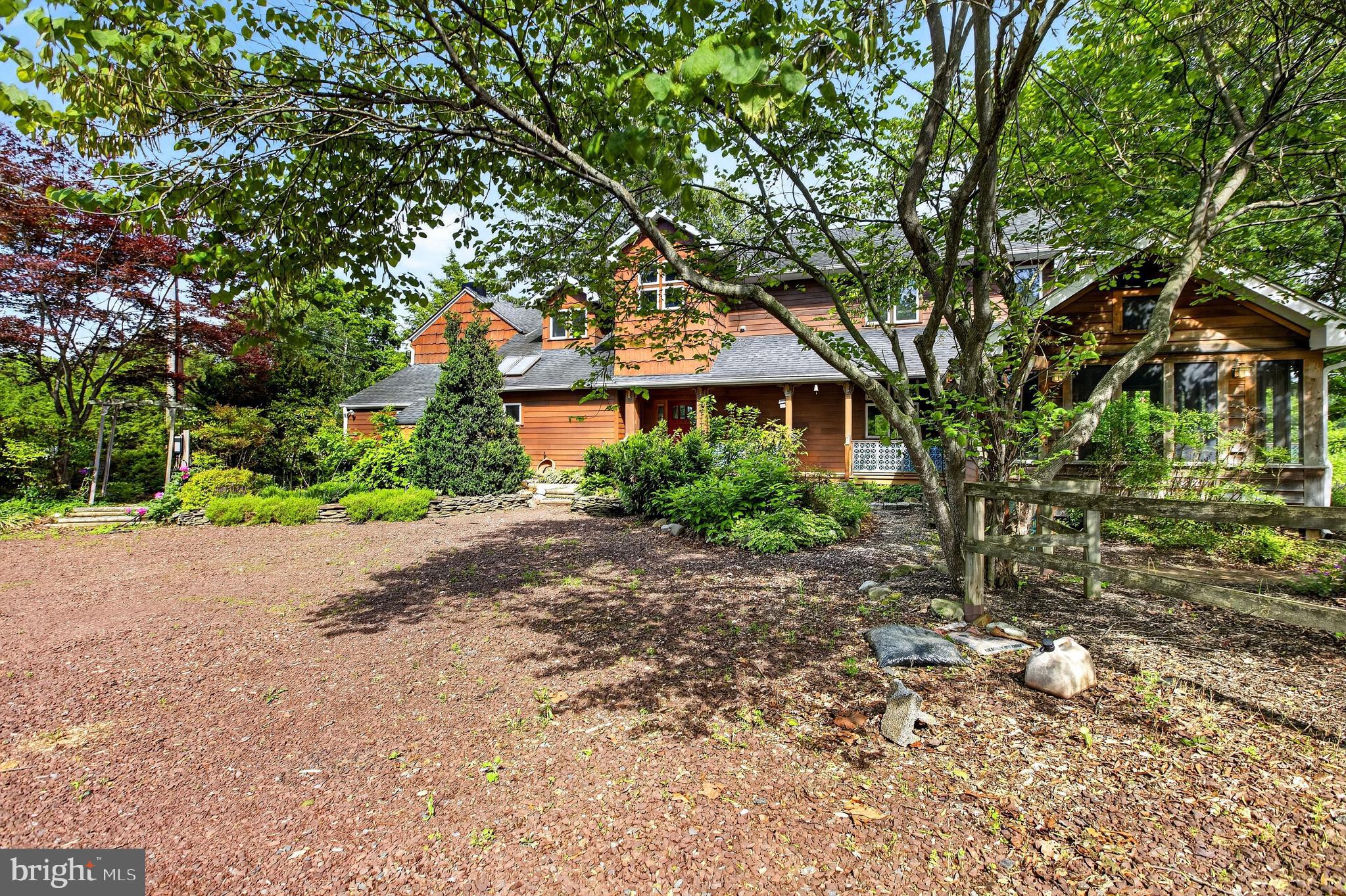 498 Perrineville Road Robbinsville, NJ 08691 - Photo 58 of 59 a front view of a house with a yard and a garage