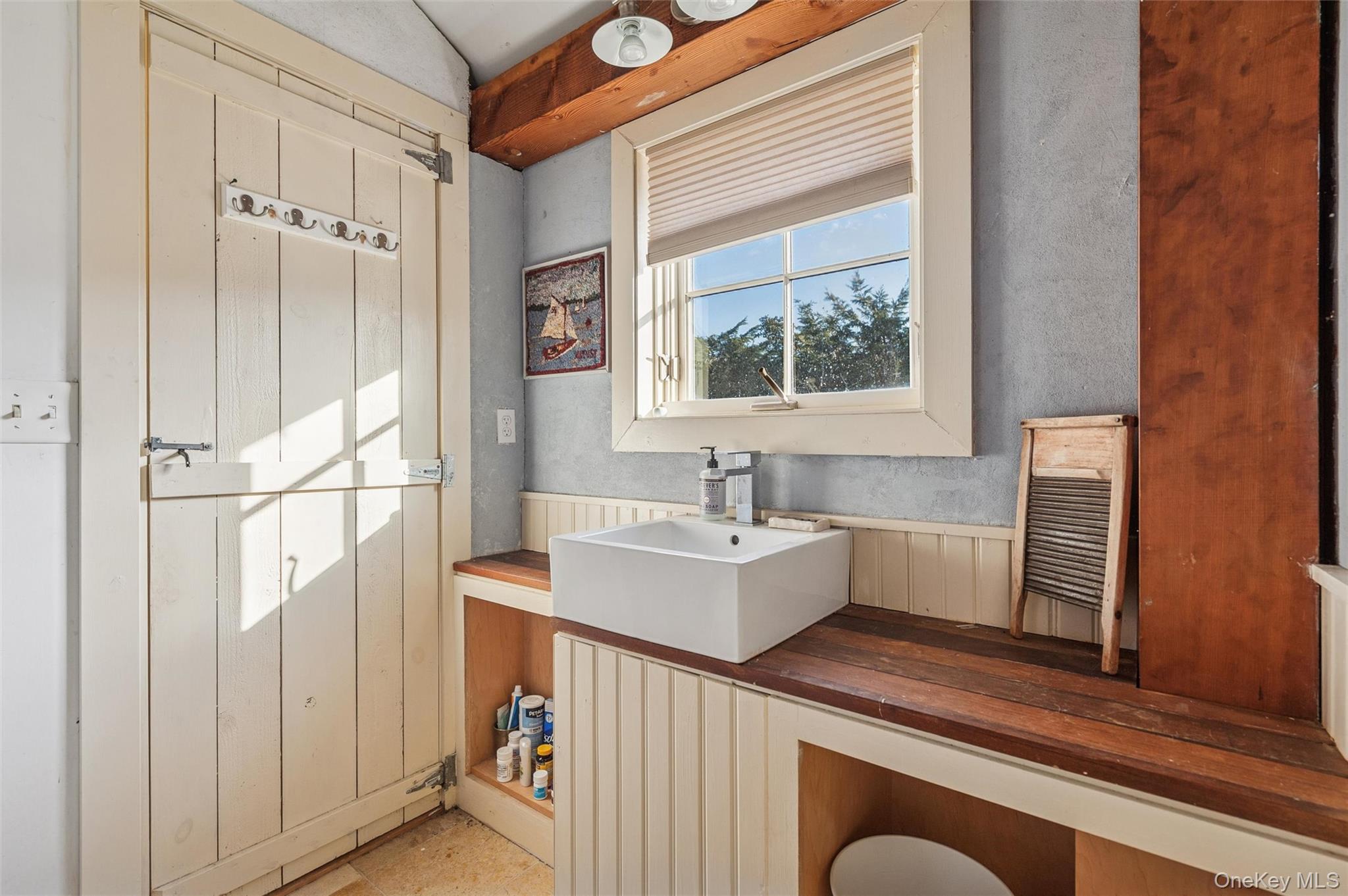 7 Jagger Lane Westhampton, NY 11977 - Photo 13 of 22 Bathroom with vanity and wainscoting
