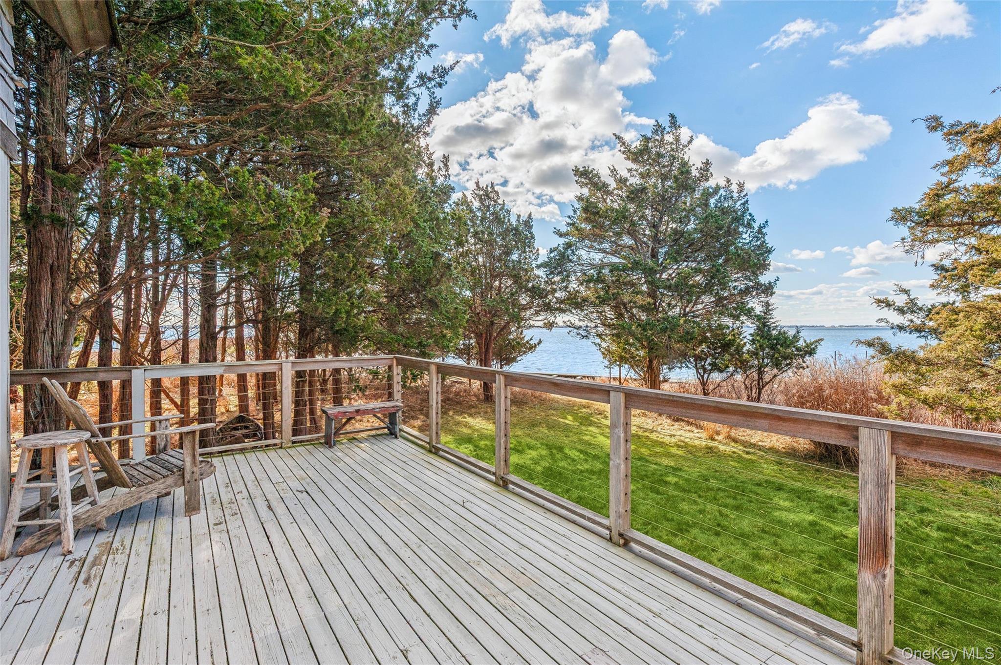 7 Jagger Lane Westhampton, NY 11977 - Photo 8 of 22 Wooden terrace featuring a yard and a water view