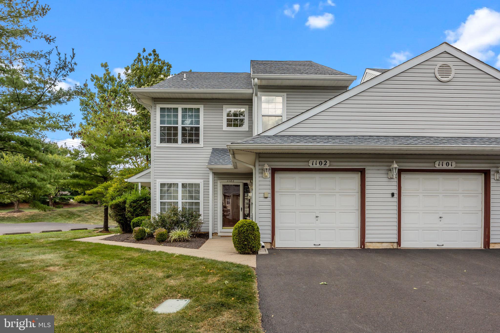 1102 Waterford Road, Unit 1 Yardley, PA 19067 - Photo 1 of 31 a front view of a house with garden