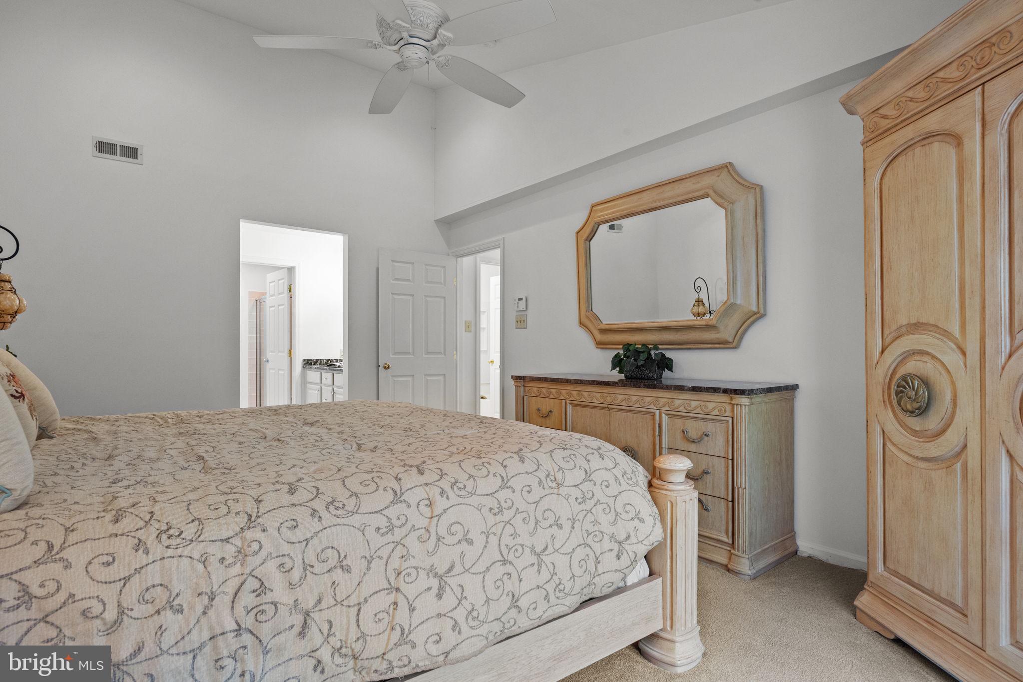 1102 Waterford Road, Unit 1 Yardley, PA 19067 - Photo 17 of 31 a bedroom with a bed and a mirror