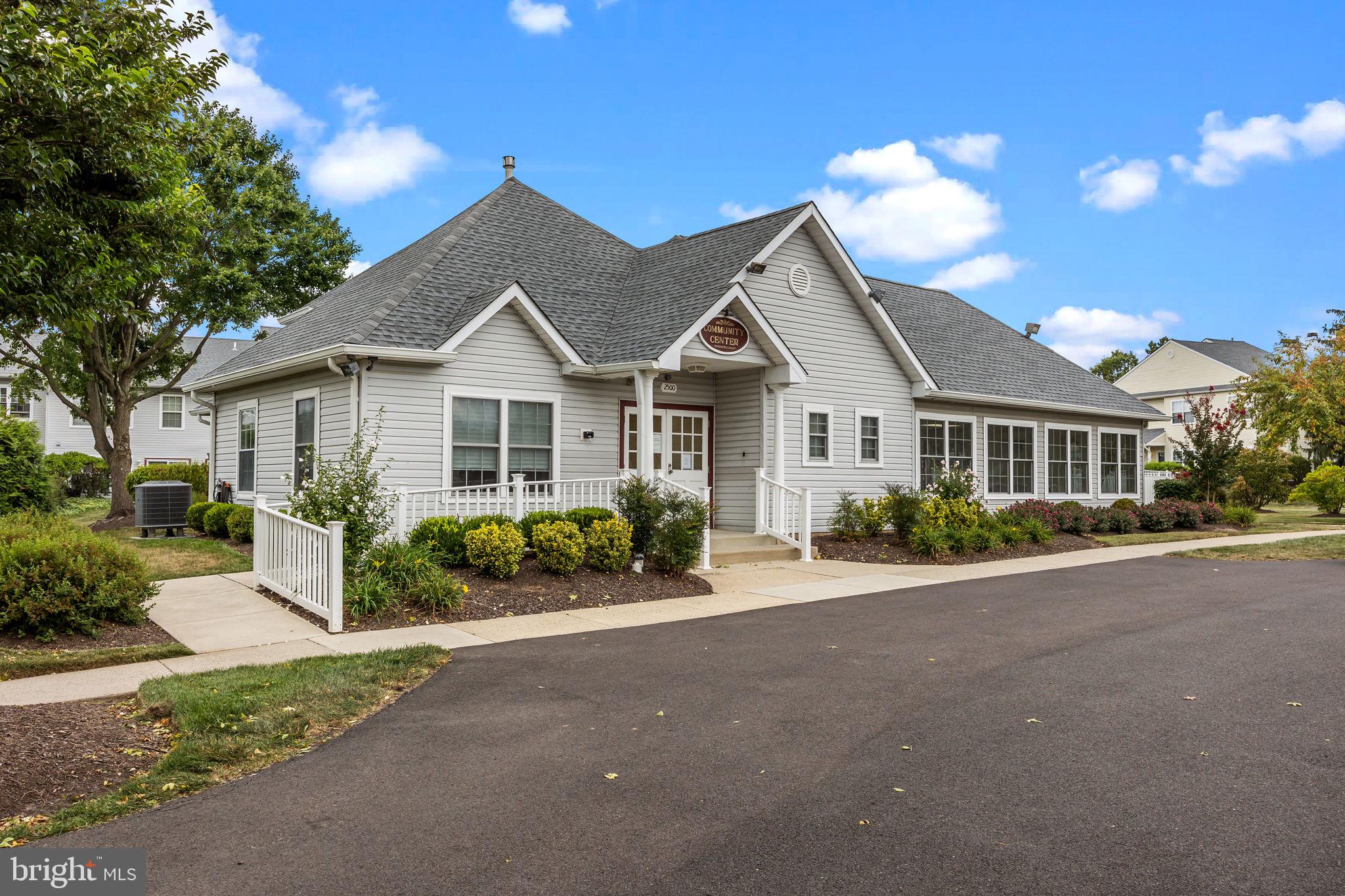 1102 Waterford Road, Unit 1 Yardley, PA 19067 - Photo 29 of 31 a front view of a house with a garden