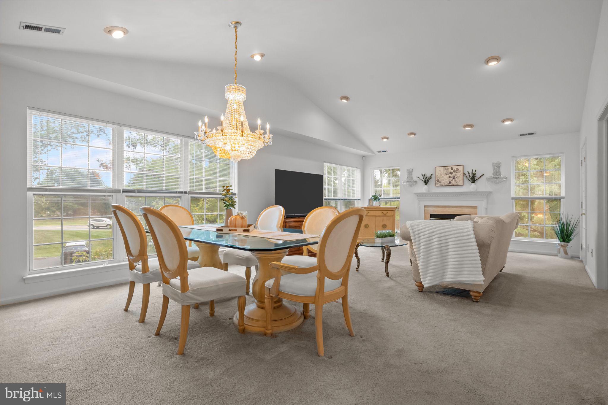 1102 Waterford Road, Unit 1 Yardley, PA 19067 - Photo 10 of 31 a dining room with furniture a chandelier and window