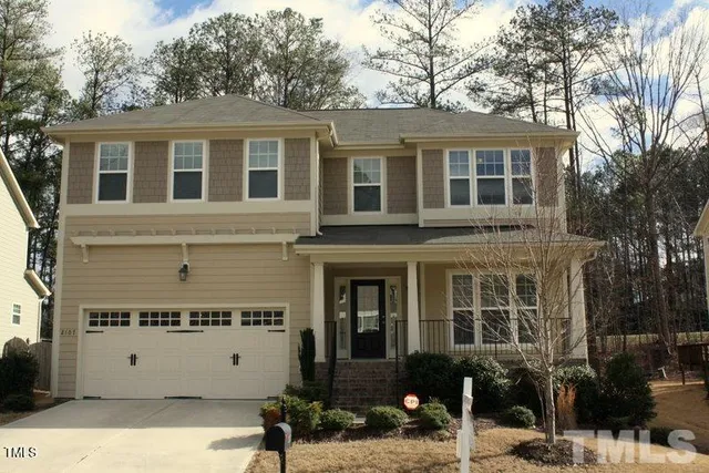 a view of a building with a bench in front of house