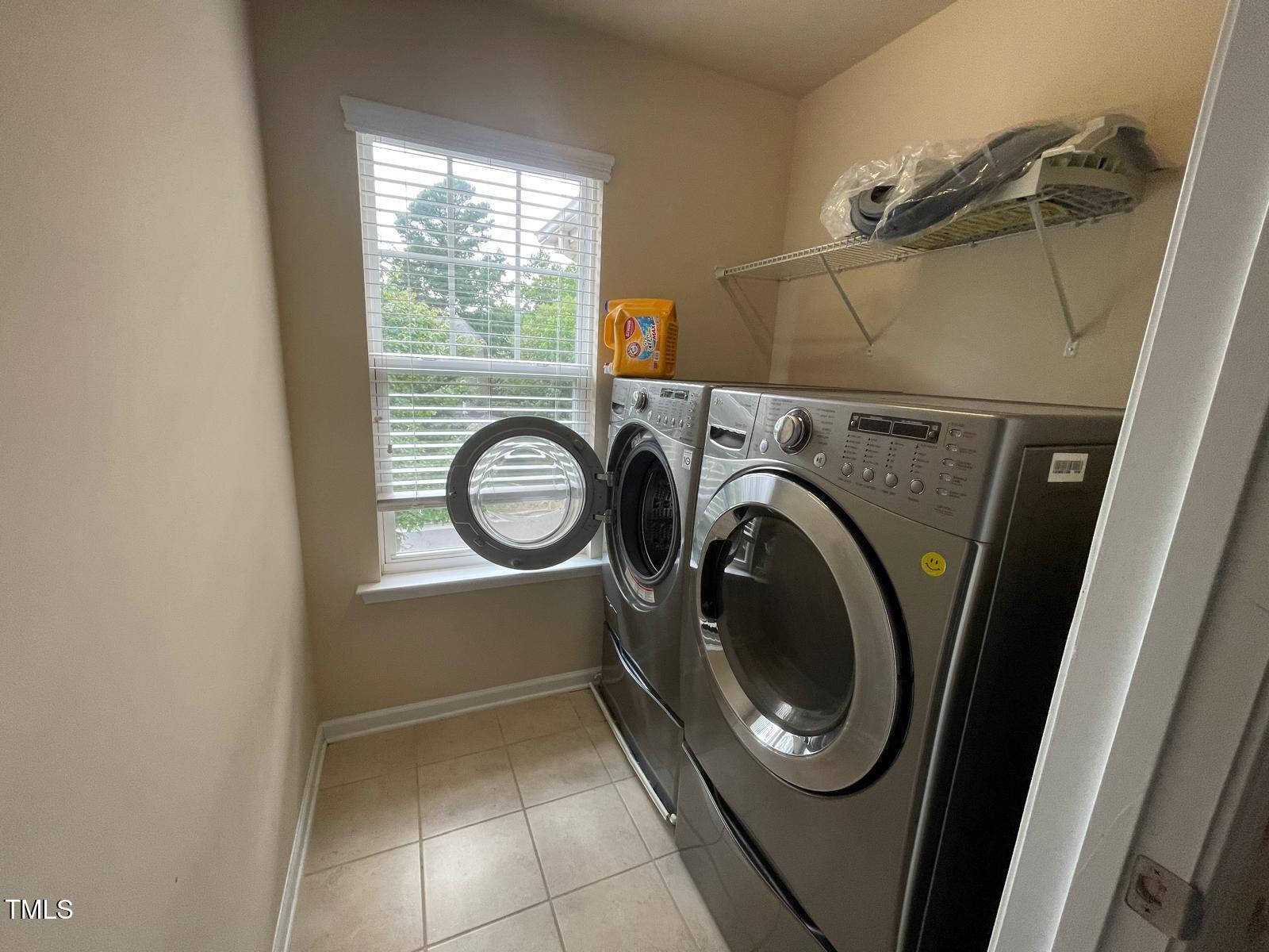 2107 Toad Hollow Trail Apex, NC 27502 - Photo 16 of 28 a utility room with dryer and washer