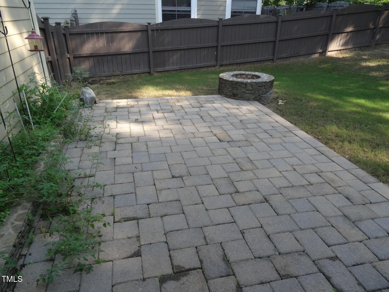 2107 Toad Hollow Trail Apex, NC 27502 - Photo 24 of 28 a view of a backyard with water fountain