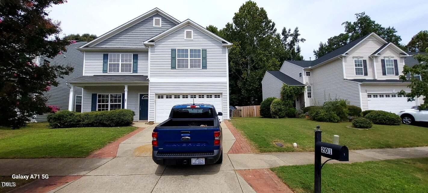 201 Jasper Point Drive Holly Springs, NC 27540 - Photo 1 of 23 a front view of a house with a yard
