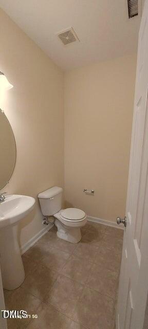 201 Jasper Point Drive Holly Springs, NC 27540 - Photo 15 of 23 a white toilet sitting next to a white cabinet