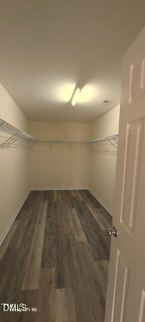 201 Jasper Point Drive Holly Springs, NC 27540 - Photo 21 of 23 a view of a room with racks on the wall