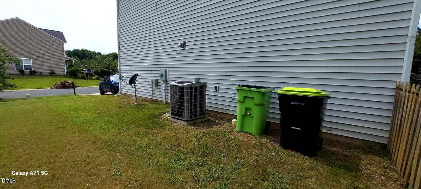 201 Jasper Point Drive Holly Springs, NC 27540 - Photo 23 of 23 a view of a house with backyard and sitting area
