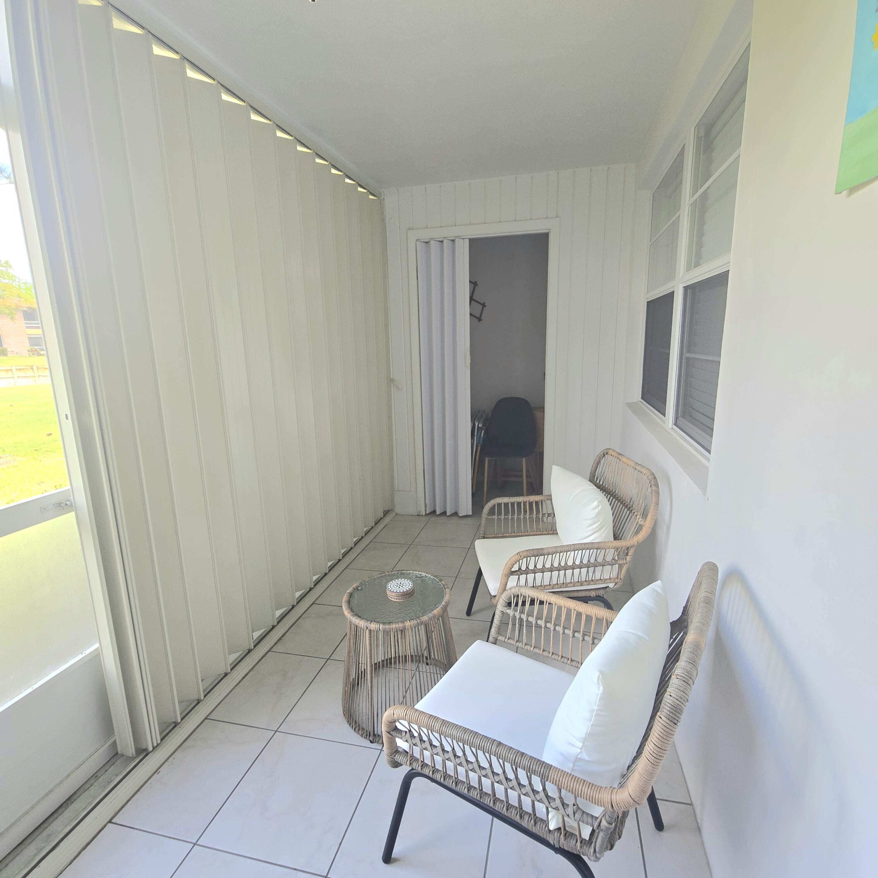 1967 Southwest Palm City Road, Unit 34C Stuart, FL 34994 - Photo 15 of 25 a living room with furniture and a window