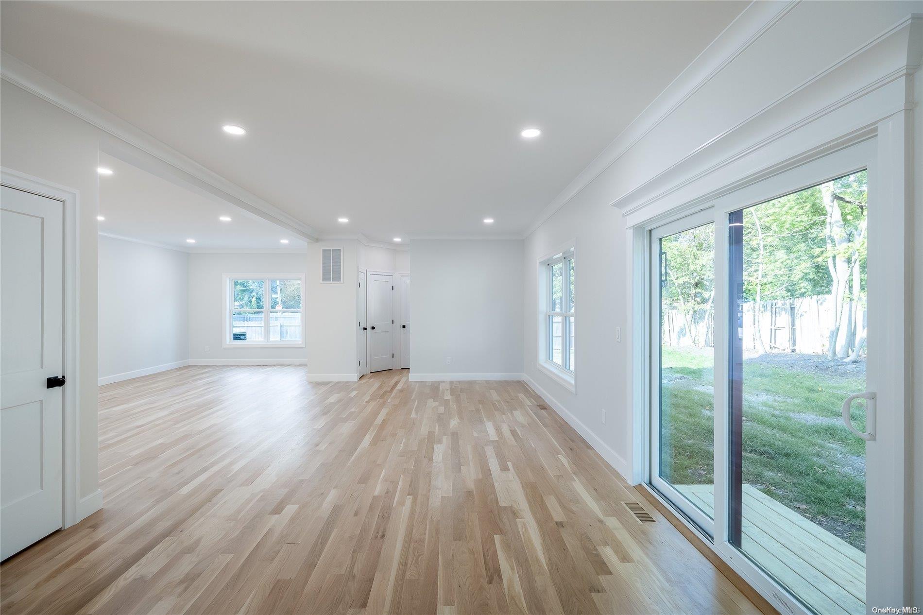 New Constr Pleasant Avenue Centereach, NY 11720 - Photo 10 of 17 a view of empty room with wooden floor and fan