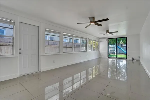 a view of an empty room with a window