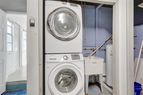 a view of a hallway with washer and dryer