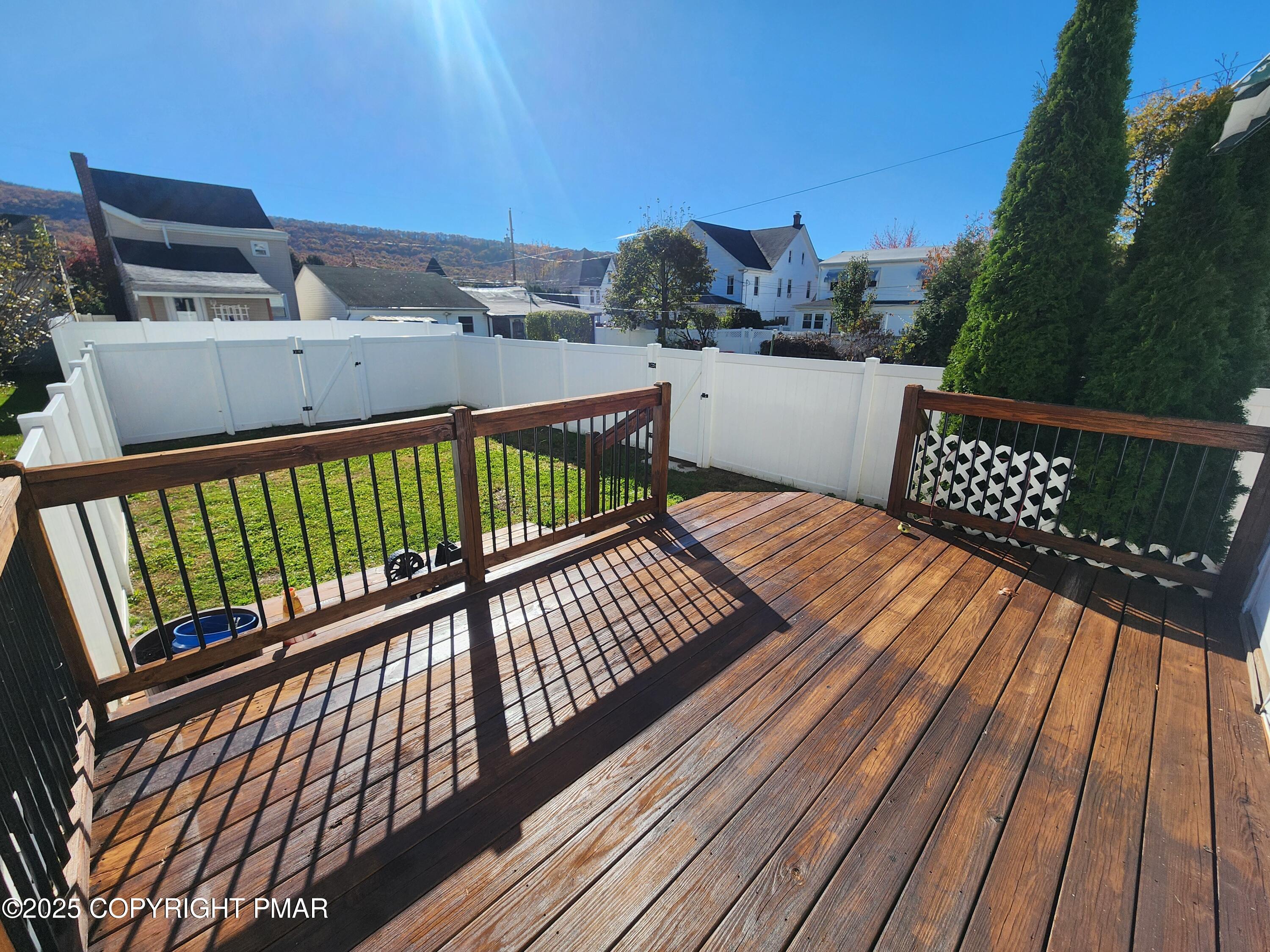 514 North Street, Unit 2 Jim Thorpe, PA 18229 - Photo 20 of 22 a view of balcony with wooden floor and fence