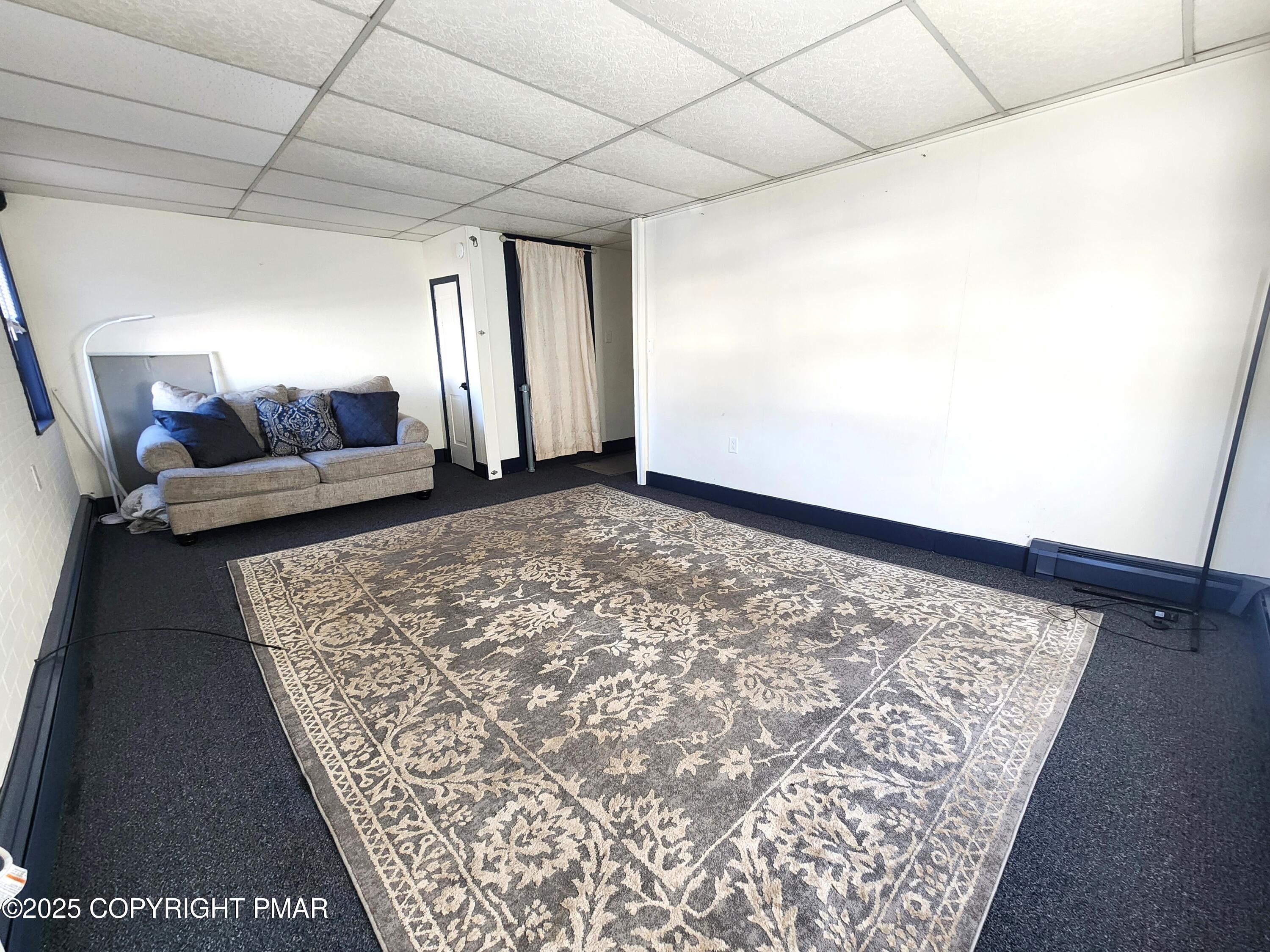 514 North Street, Unit 2 Jim Thorpe, PA 18229 - Photo 6 of 22 a view of a big room with wooden floor and furniture