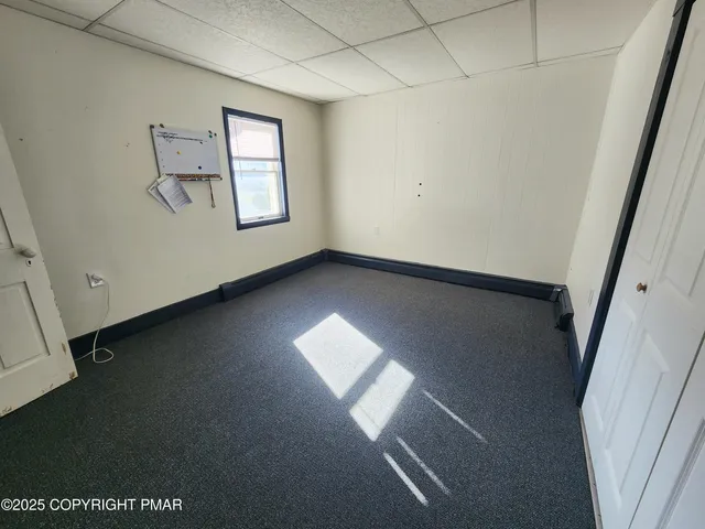 a view of empty room with windows