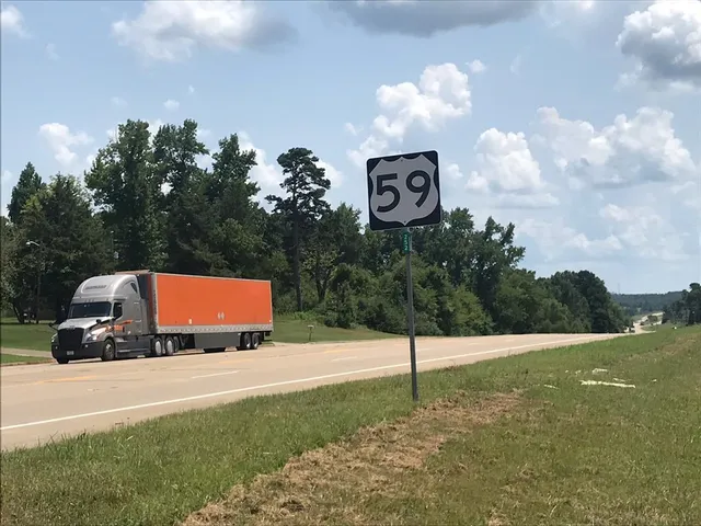 a car parked in the middle of a field