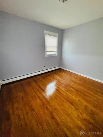 a view of an empty room with windows