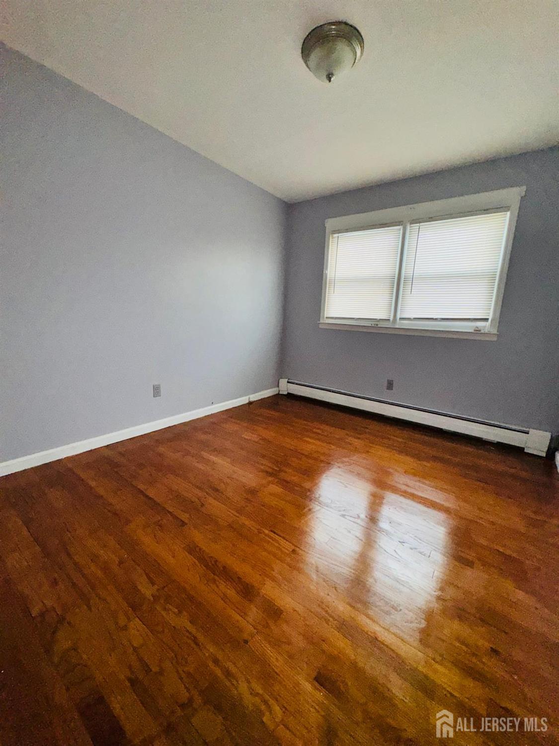 32 Union Place Irvington, NJ 07111 - Photo 9 of 14 an empty room with a window