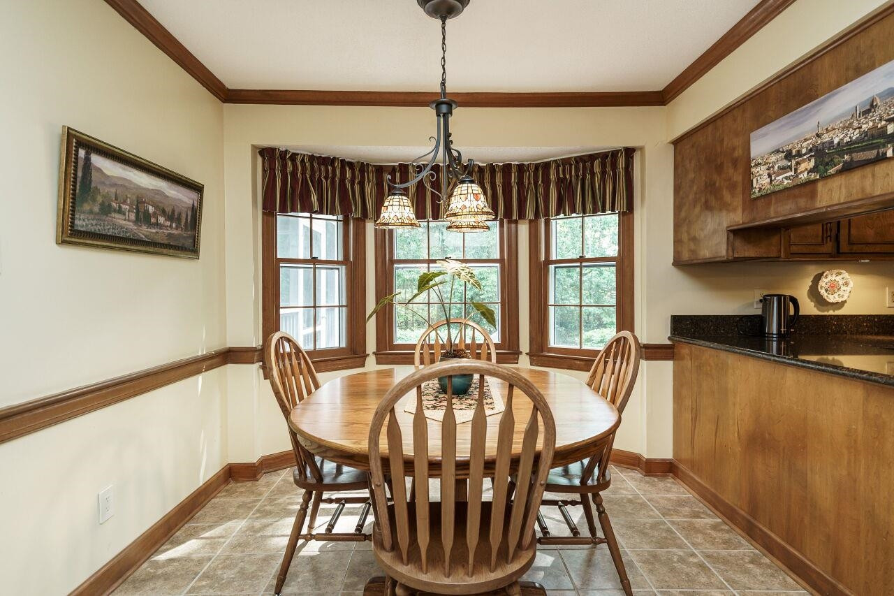 8116 Calais Court Raleigh, NC 27613 - Photo 13 of 33 Eat-in kitchen with view of the wooded lot Breakfast Nook