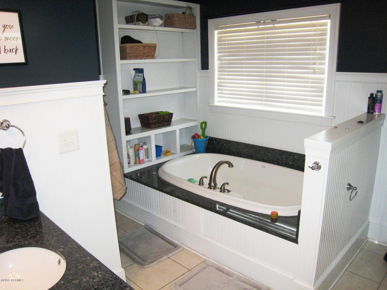 247 Lyman Road Beulaville, NC 28518 - Photo 19 of 35 Luxurious master bath has oversized tub with window