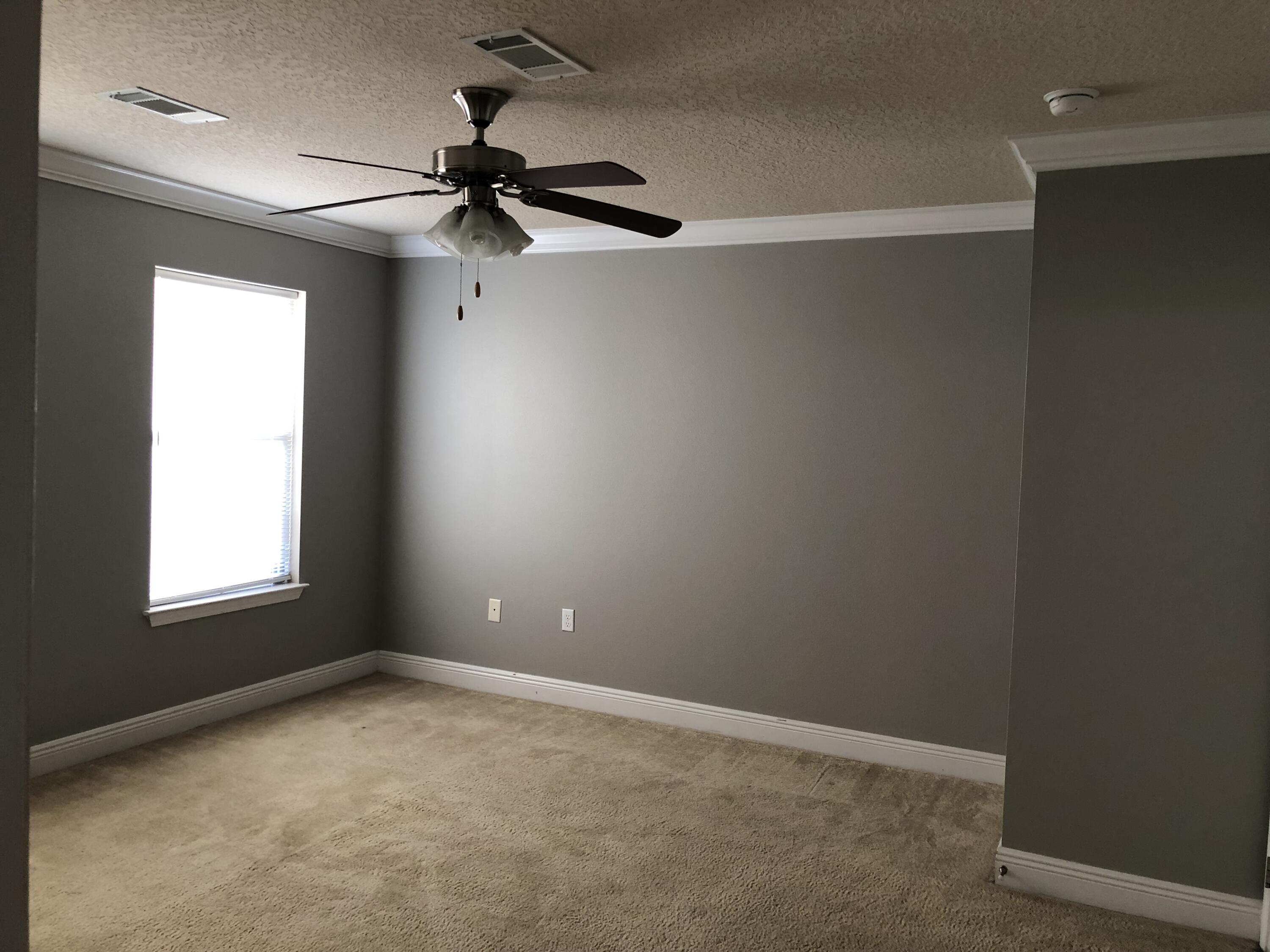 662 Red Fern Road Crestview, FL 32536 - Photo 6 of 9 an empty room with a window and a fan