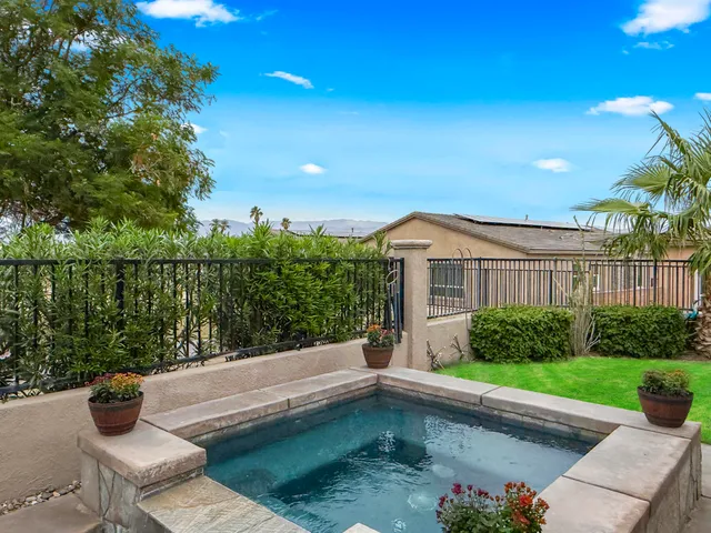 a view of house with swimming pool outdoor seating