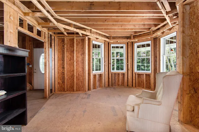 a view of a room with window and a bathtub