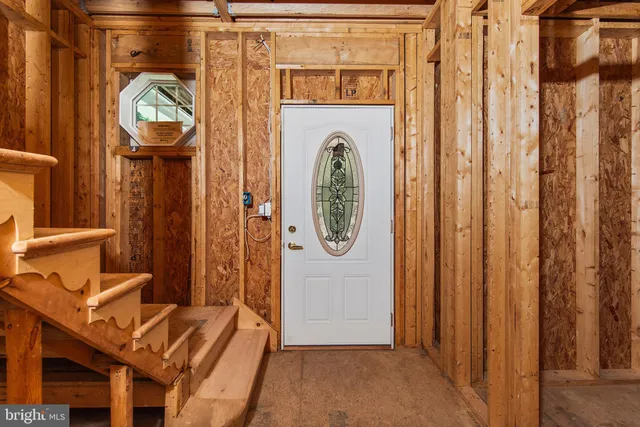 a view of front door with stairs