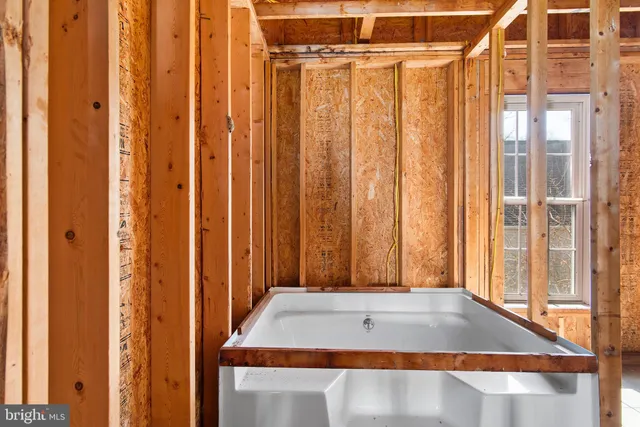 a view of a room with furniture and a window