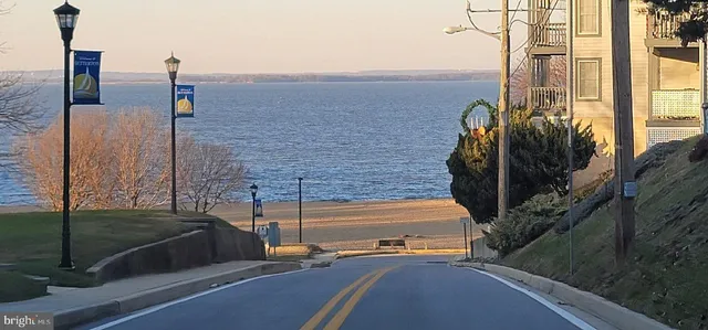 a view of a balcony with chairs and wooden floor