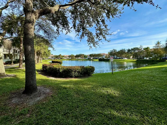 a view of a lake with houses in the back