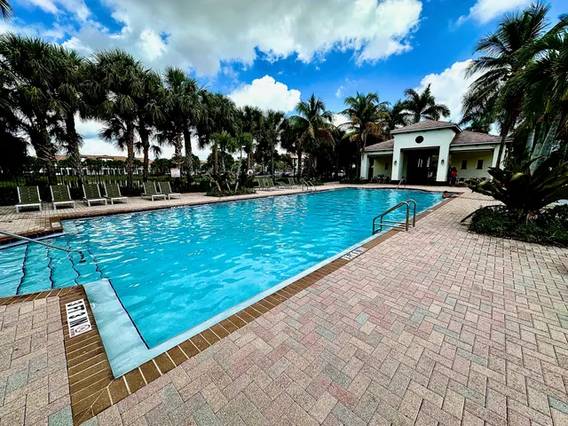 a view of a swimming pool with a garden