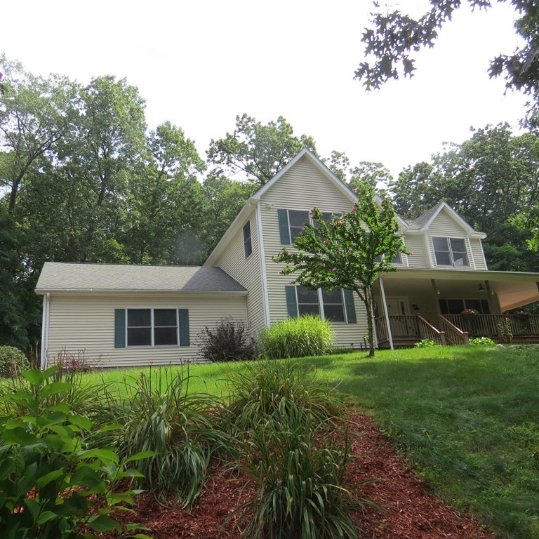 888 Florence Road Northampton, MA 01062 - Photo 1 of 37 a front view of house with a garden