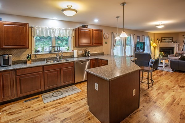 888 Florence Road Northampton, MA 01062 - Photo 13 of 37 a kitchen with a stove sink cabinets and refrigerator