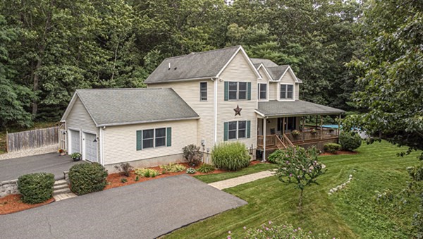 888 Florence Road Northampton, MA 01062 - Photo 2 of 37 a front view of a house with a yard and potted plants